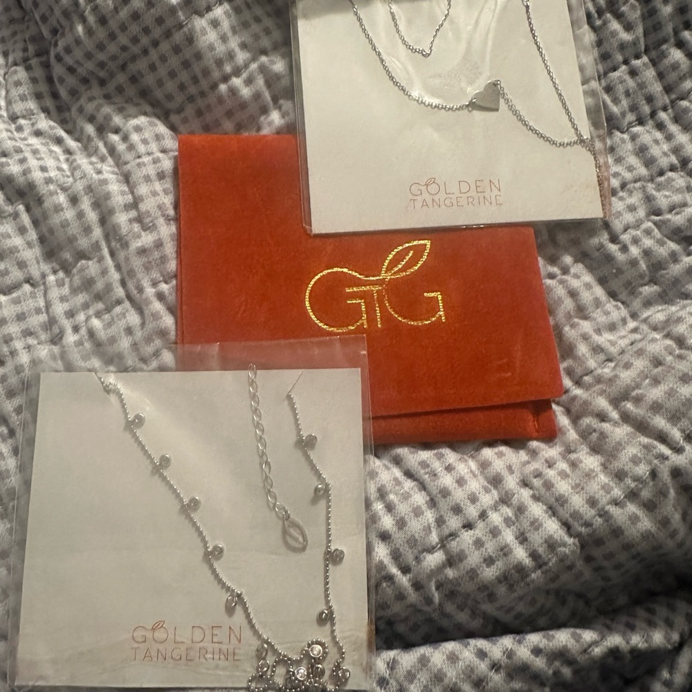 TWO silver necklaces one with stones. Sealed never opened.